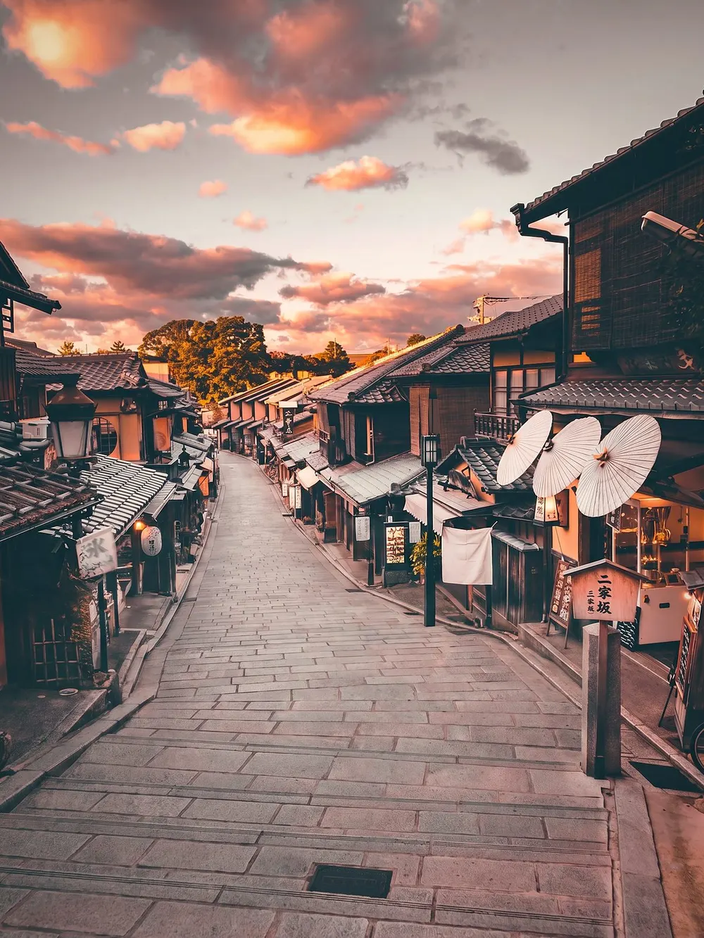 The same Kyoto street after ClearShot, with every person removed and the stone path rebuilt